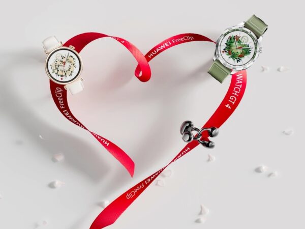 A heart shaped red ribbon with two watches Description automatically generated