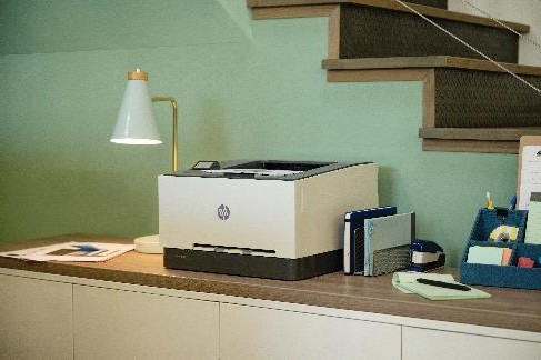 A printer on a desk  Description automatically generated